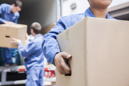 Professional office removals planning in Fulham with packed boxes and workspace equipment