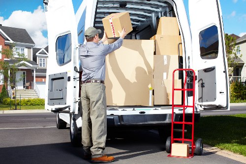 Professional movers carrying furniture in Fulham