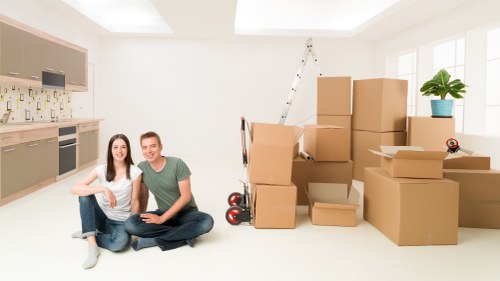 Fragile items being carefully packed by movers in Fulham